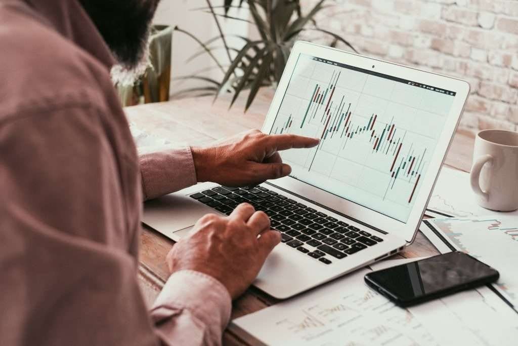 Man looking at trading platform screen