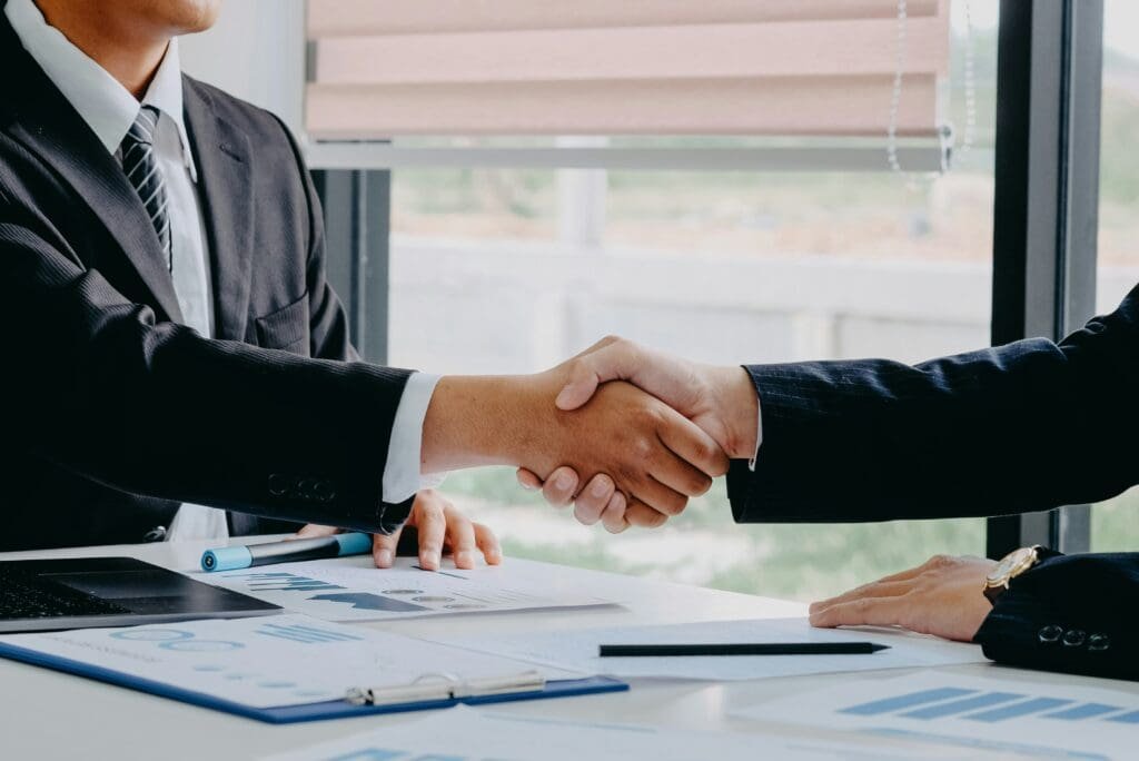 A man and woman shaking hands